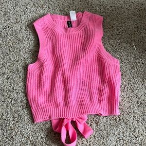 pink knit top with back hole